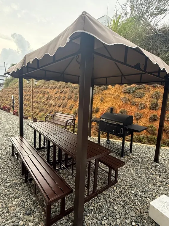 BBQ gazebo with benches and grill on the Villa Plus terrace