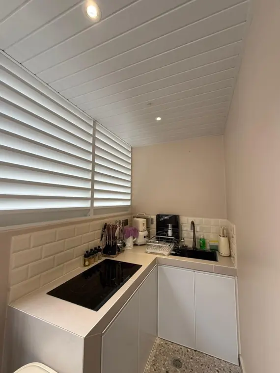 Neptune's kitchen with induction hob under the window shutters