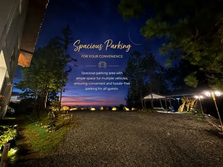 Saturn's lamp-lit private parking area at dusk, with room for several cars