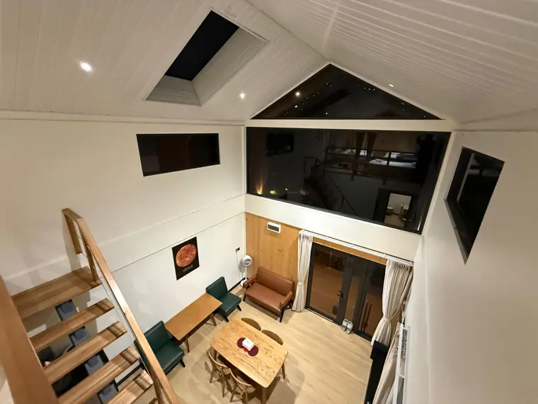 Looking down on the living room from a residence mezzanine